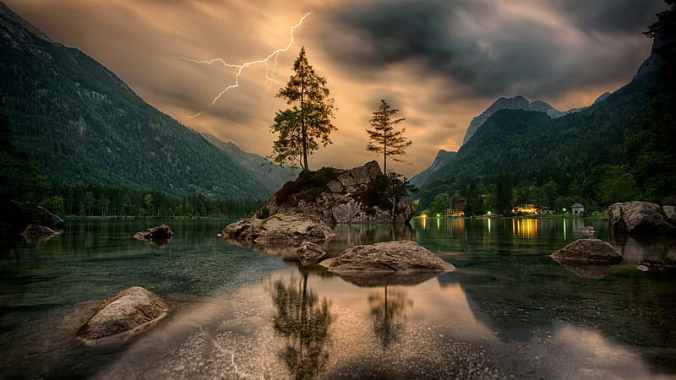 green-and-brown-tree-painting-reflective-photography-of-trees-rocks-and-mountain-with-lightning-strike-in-background